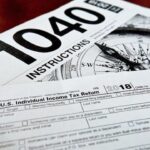 A close-up photograph of a Form 1040 for the 2022 tax year, highlighting the impending April 15 deadline for claiming unclaimed refunds.